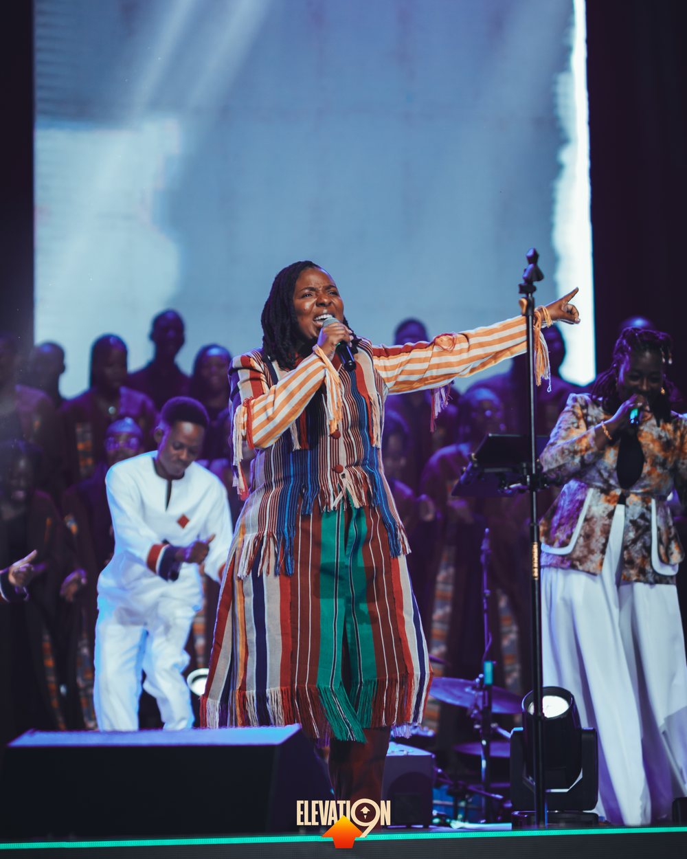 Clarisse Flambeau leading worship, close-up